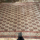 1970s beige large vintage persian rug with floral design, hand-knotted weave and low pile.