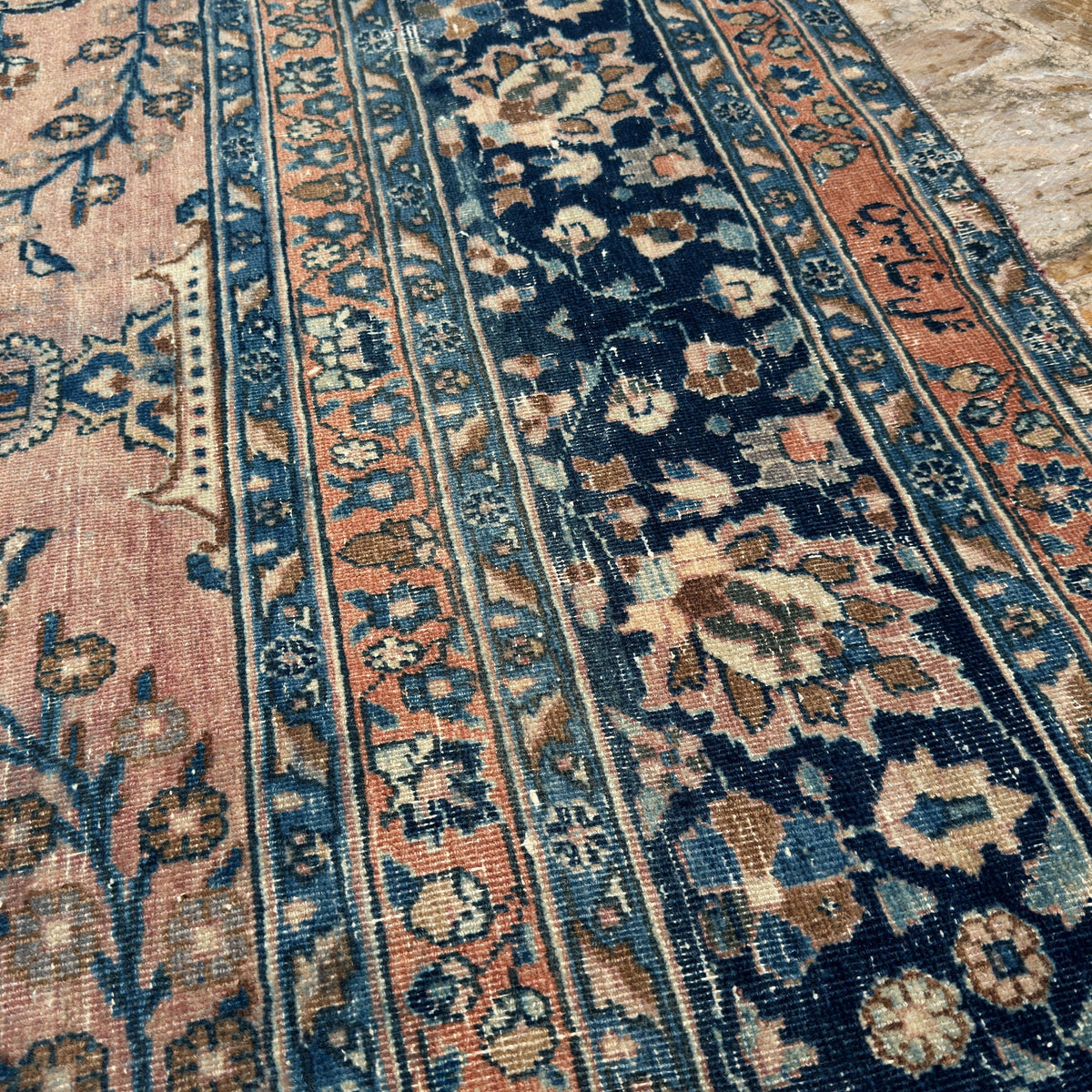 Additional view of the pink large vintage persian rug, hand-knotted in wool and cotton.