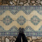 1970s pale blue Turkish large vintage rug with traditional design, hand-knotted weave and low pile.