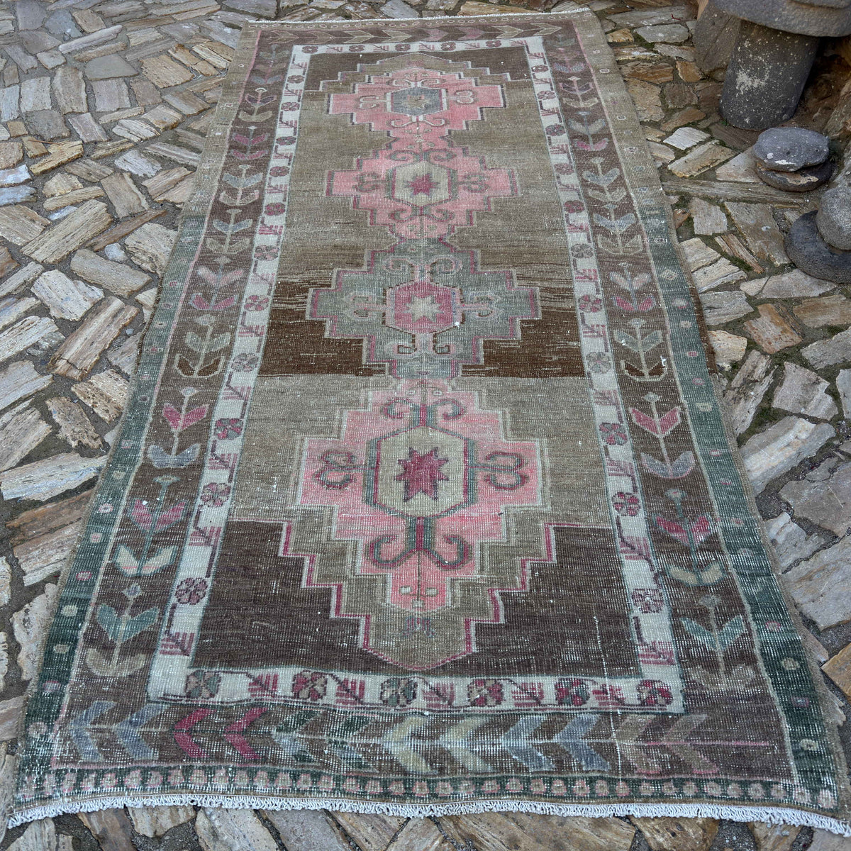 Pale Pink 5' x 10' Turkish large vintage rug in wool and cotton, shown on the floor.