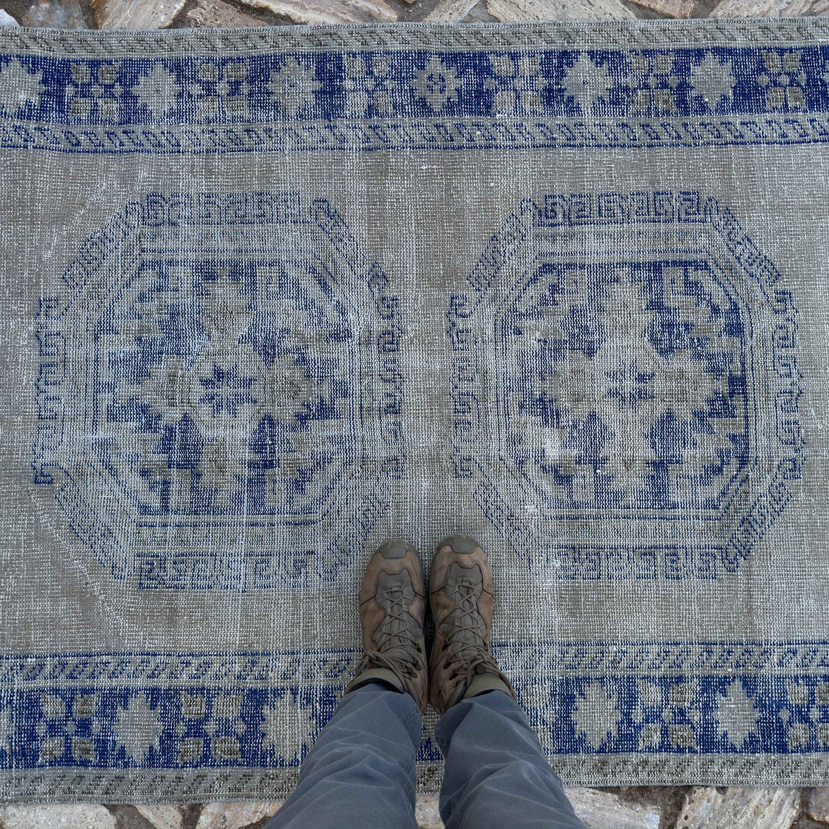 1970s blue Turkish large vintage rug with neutral design, hand-knotted weave and low pile.