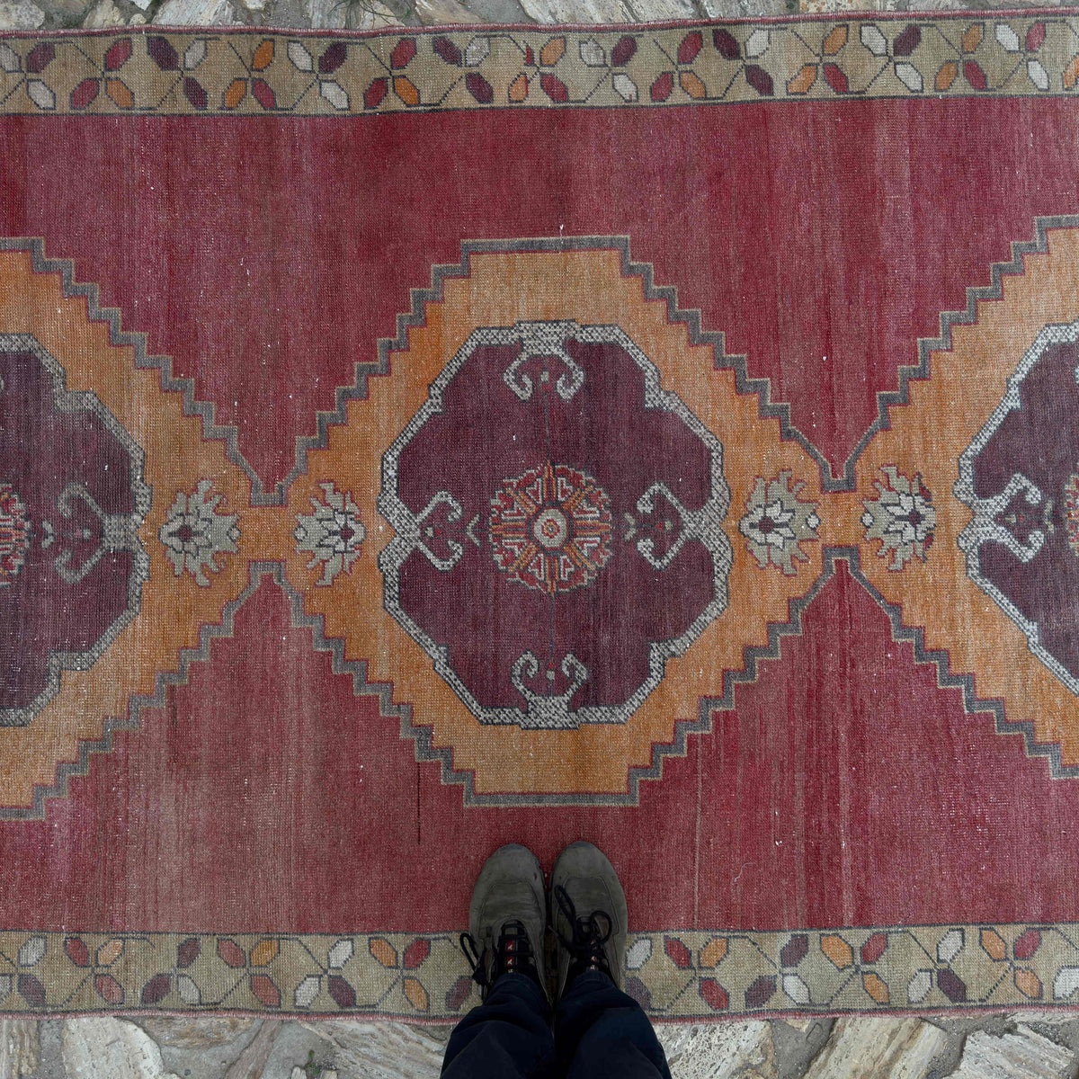 1970s pale red Turkish large vintage rug with traditional design, hand-knotted weave and low pile.