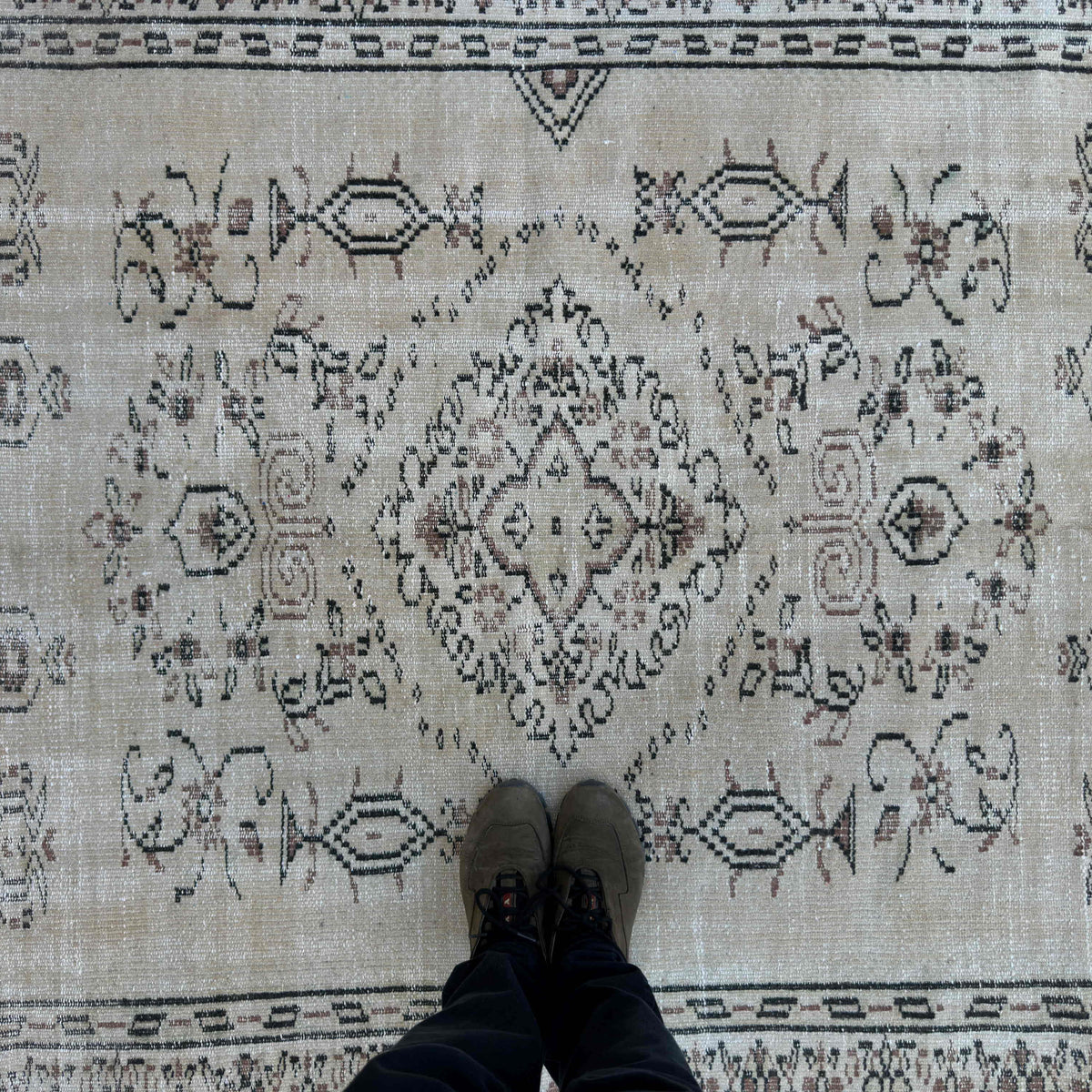 1970s beige Turkish large vintage rug with neutral design, hand-knotted weave and low pile.