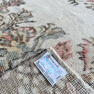 1970s pink Turkish large vintage rug with medallion design, hand-knotted weave and low pile.
