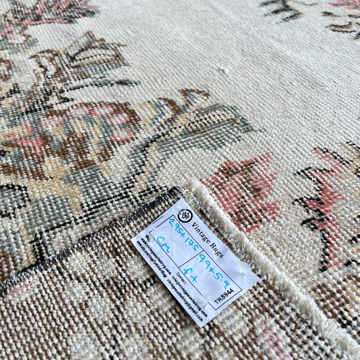 1970s pink Turkish large vintage rug with medallion design, hand-knotted weave and low pile.