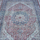 Close-up of the red Turkish large vintage rug showing traditional details, hand-knotted weave, wool and cotton and low pile.