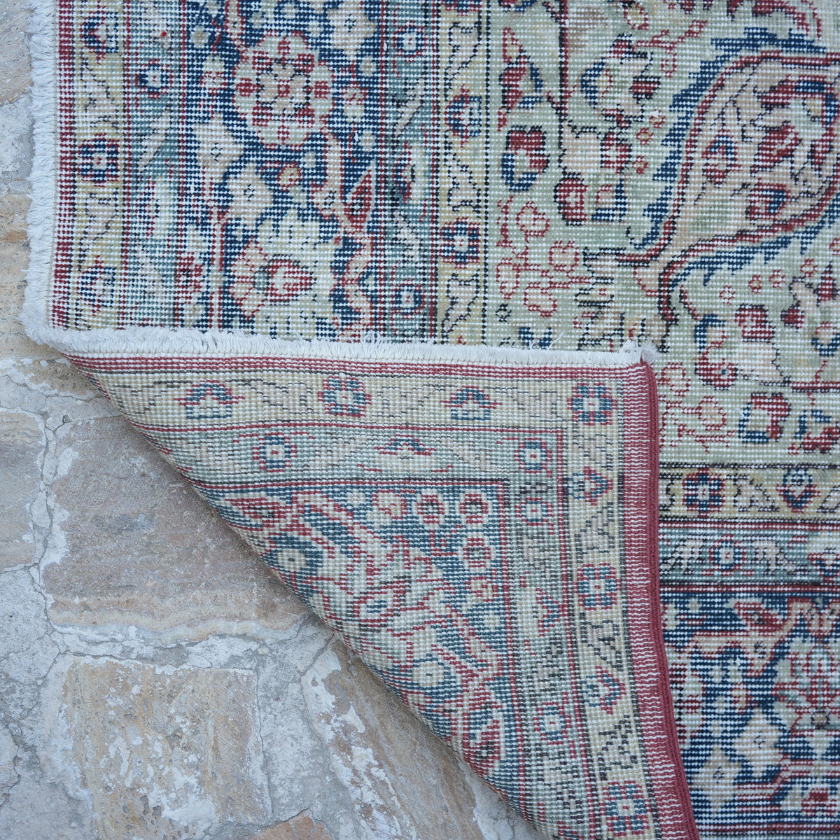 1970s red Turkish large vintage rug with traditional design, hand-knotted weave and low pile.