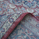 Additional view of the red Turkish large vintage rug, hand-knotted in wool and cotton.