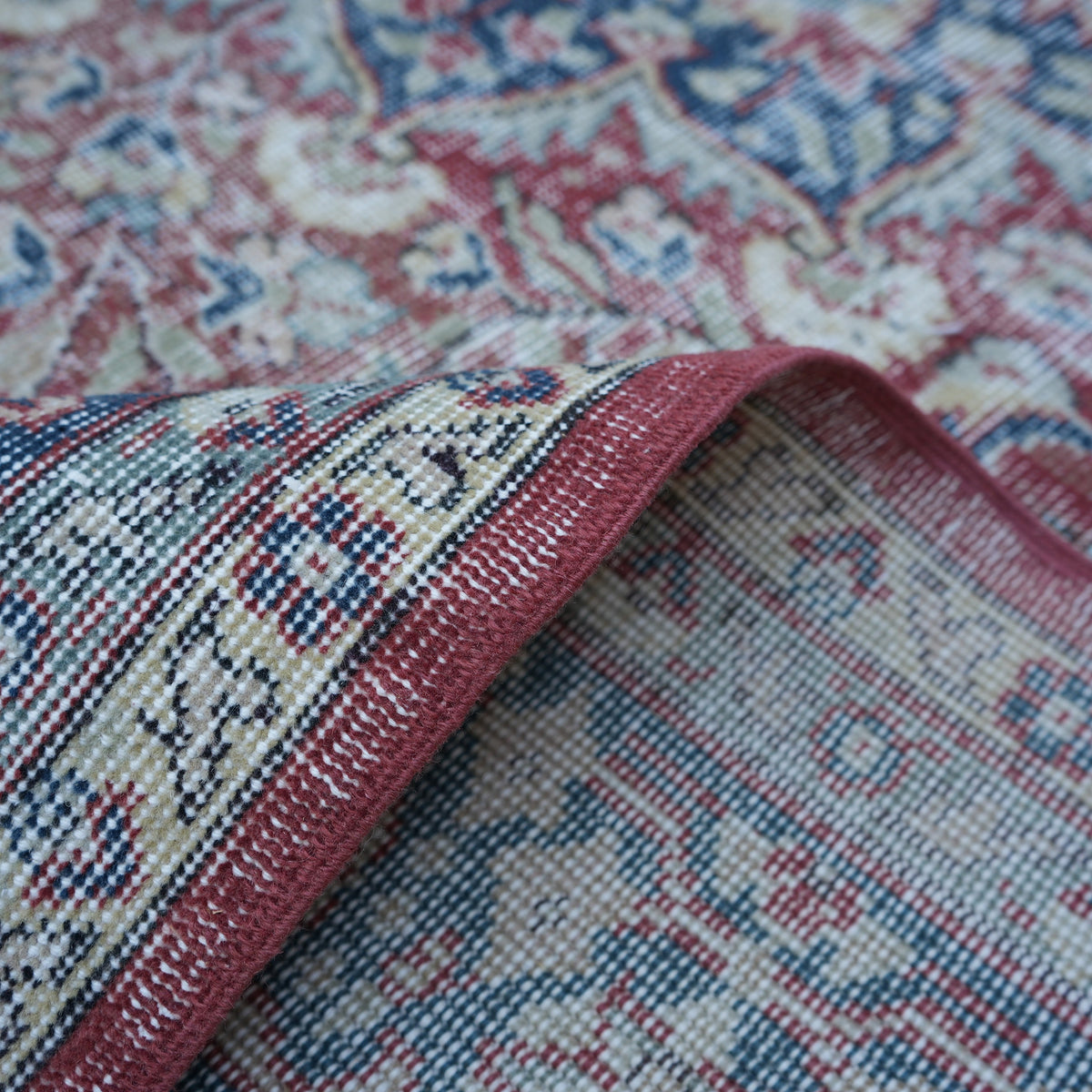 Additional view of the red Turkish large vintage rug, hand-knotted in wool and cotton.
