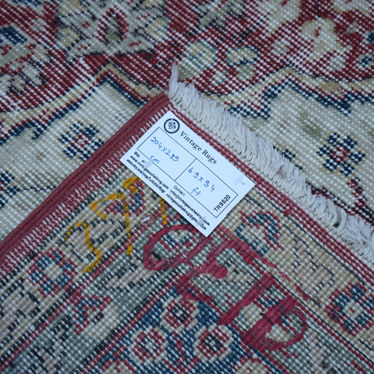 Red 7' x 9' Turkish large vintage rug from the 1970s with traditional design.