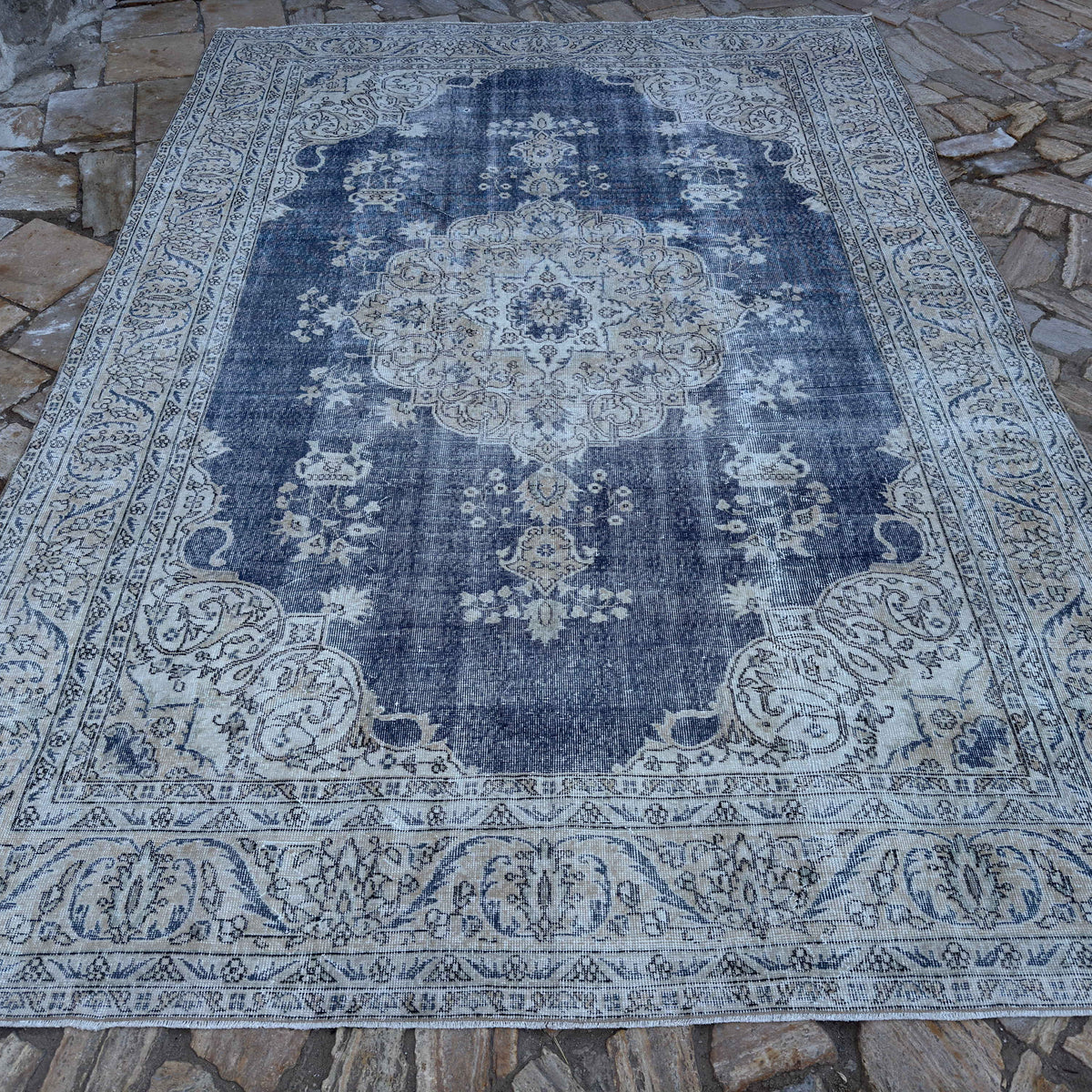 Blue 8' x 11' Turkish large vintage rug in wool and cotton, shown on the floor.