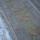 Pale Brown 5' x 11' Turkish large wool rug in wool, shown on the floor.