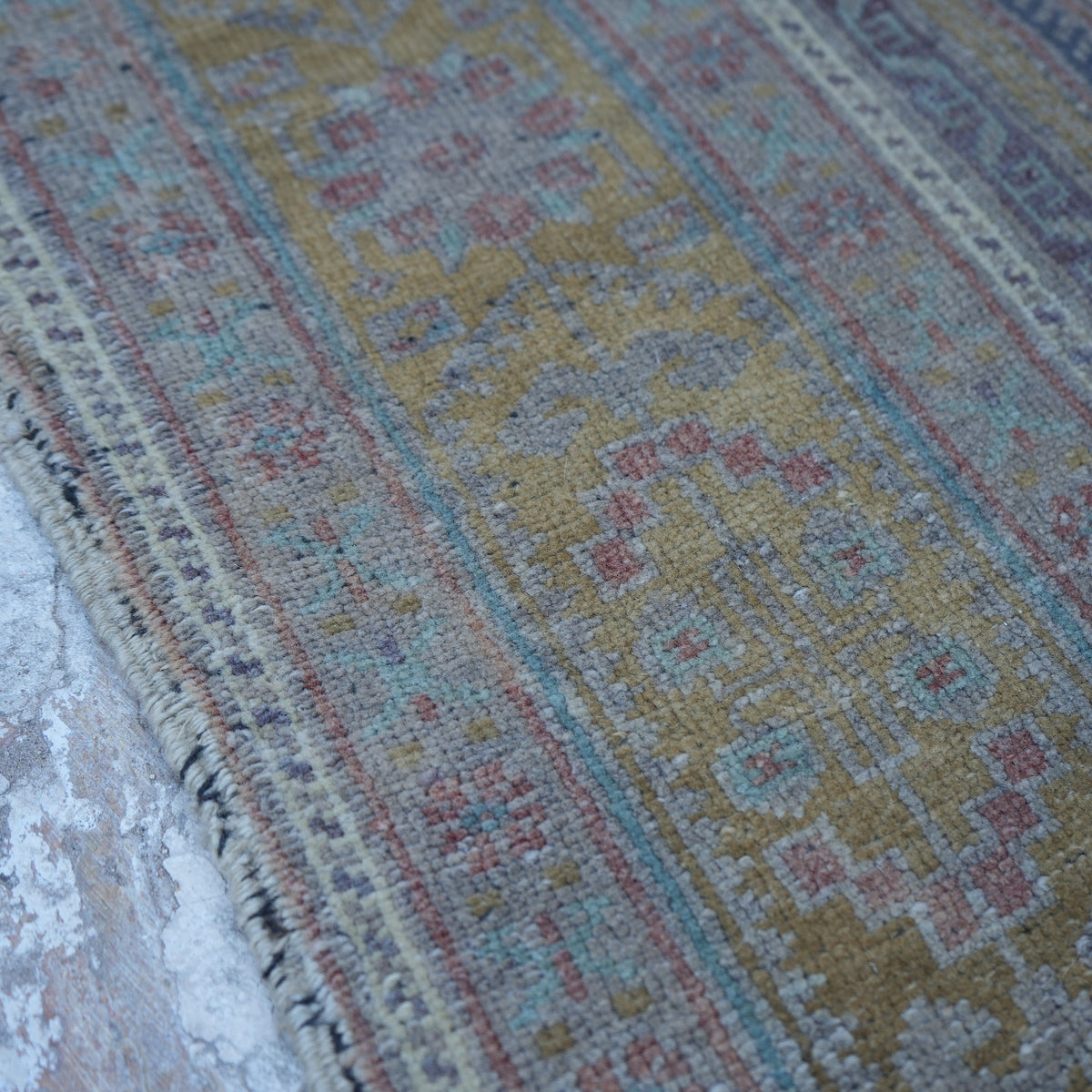 Pale Brown 5' x 11' Turkish large wool rug in wool, shown on the floor.