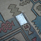 Pale Pink 7' x 10' Turkish large wool rug from the 1970s with geometric design.
