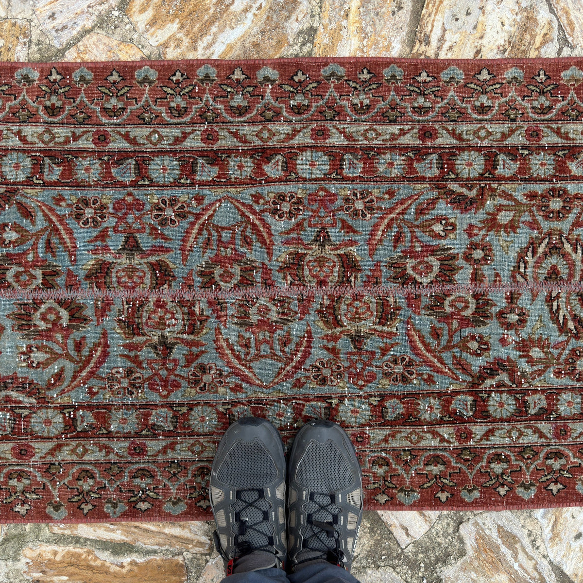 1970s brown long persian runner rug with patchwork design, hand-knotted weave and low pile.