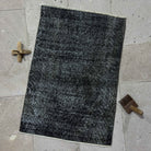 Black 2' x 3' mini overdyed rug with overdyed design, handmade in Turkey – Luci.