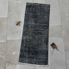 Black 2' x 4' mini runner rug with overdyed design, handmade in Turkey – Sadella.