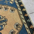 Close-up of the blue Turkish mini runner rug showing traditional details, hand-knotted weave, wool and cotton and low pile.