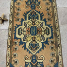 1970s blue Turkish mini runner rug with traditional design, hand-knotted weave and low pile.