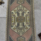 1970s pink Turkish mini runner vintage rug with traditional design, hand-knotted weave and low pile.