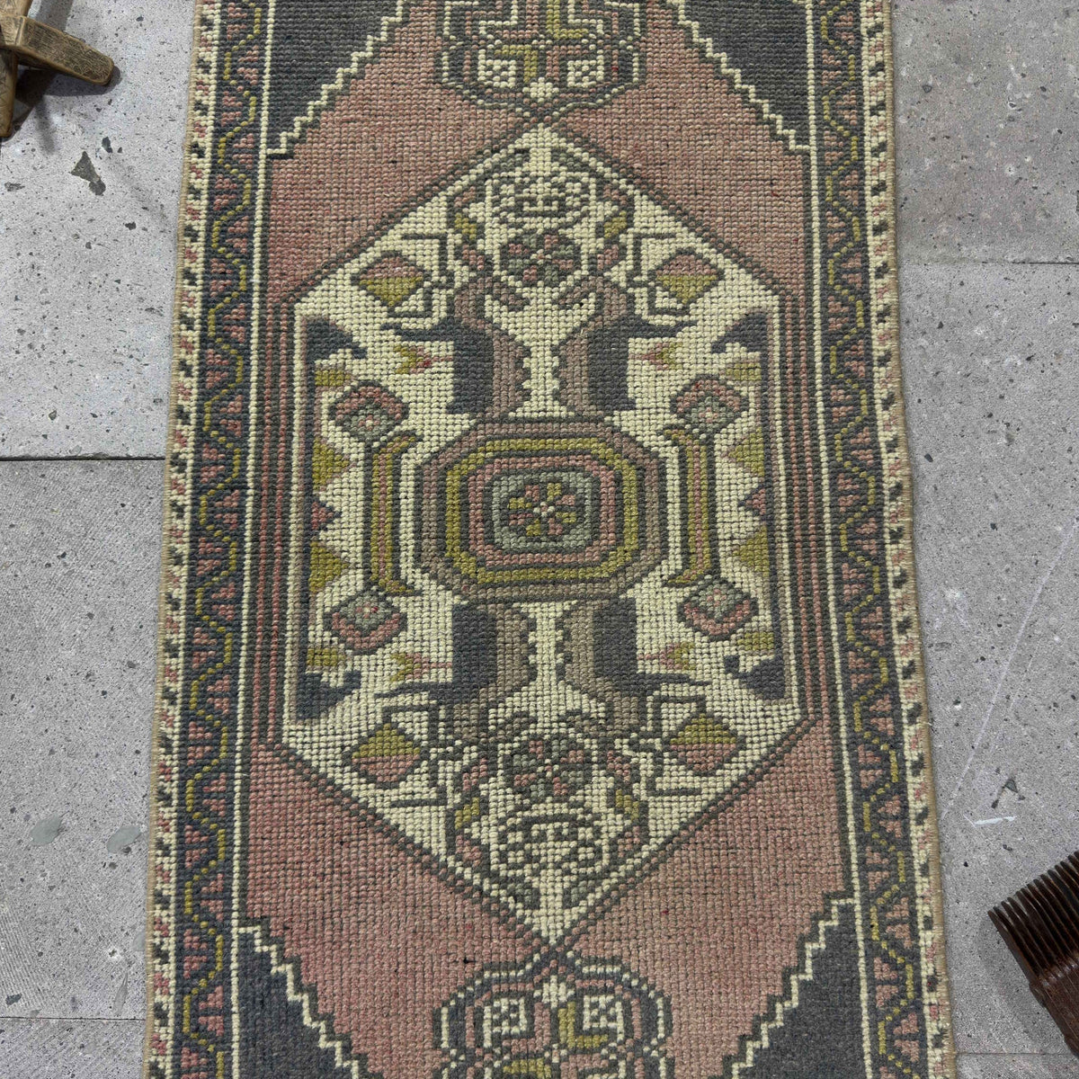 1970s pink Turkish mini runner vintage rug with traditional design, hand-knotted weave and low pile.