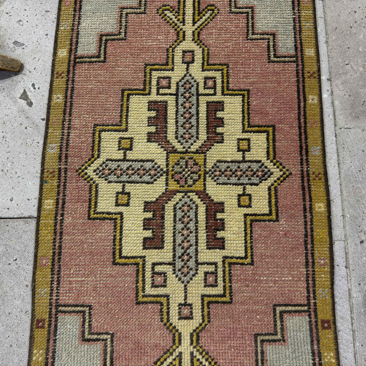 1970s pink mini turkish carpet with medallion design, hand-knotted weave and low pile.