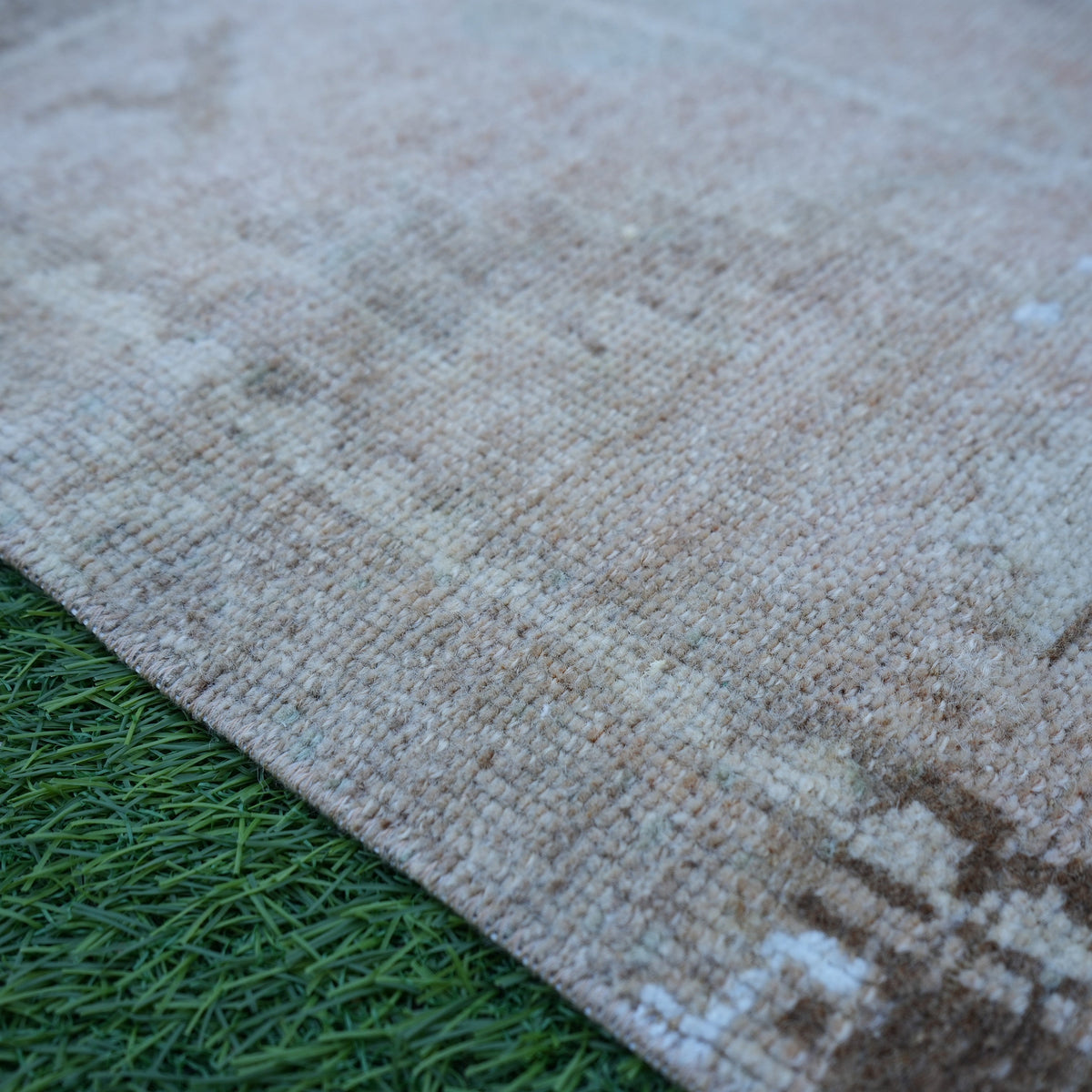 Beige 1' x 4' mini turkish rug in wool and cotton, shown on the floor.