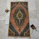 Purple 2' x 3' mini turkish rug in wool and cotton, shown on the floor.