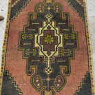 1970s purple mini turkish rug with traditional design, hand-knotted weave and low pile.