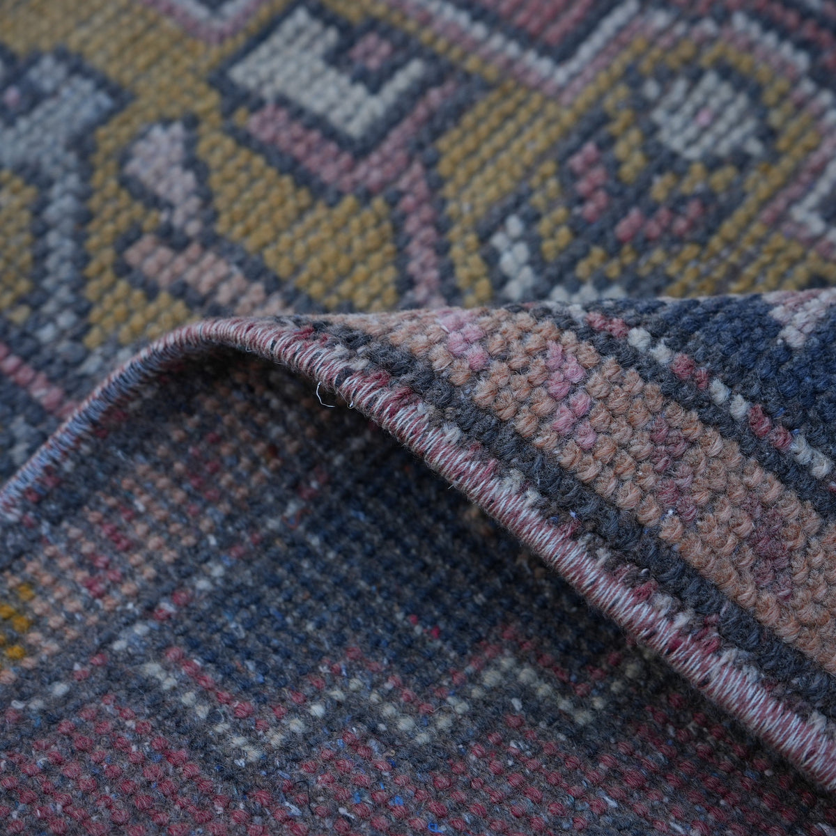 Additional view of the red mini turkish rug, hand-knotted in wool and cotton.