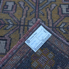 Red 2' x 3' mini turkish rug from the 1970s with traditional design.
