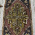 1970s red mini turkish rug with traditional design, hand-knotted weave and low pile.