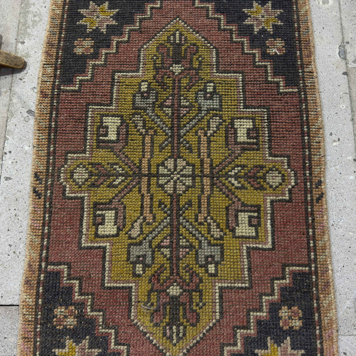 1970s red mini turkish rug with traditional design, hand-knotted weave and low pile.