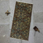 Brown 1' x 3' mini vintage rug with neutral design, handmade in Turkey – Merl.