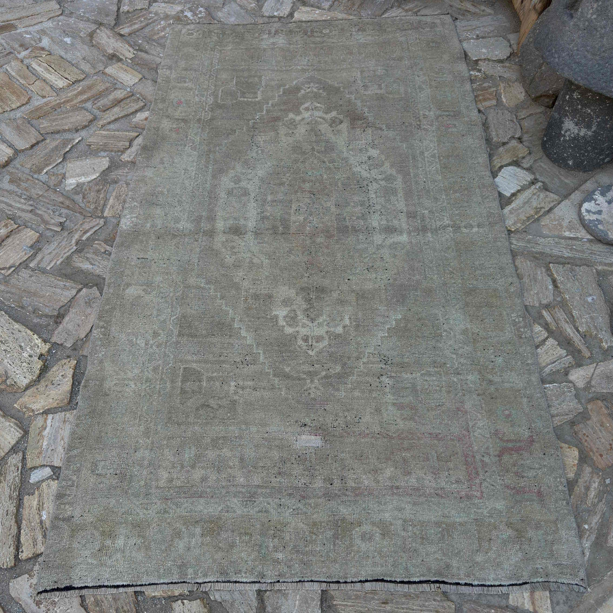 Beige 4' x 8' Turkish muted vintage rug in wool and cotton, shown on the floor.