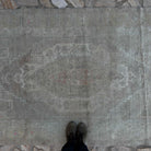 1970s beige Turkish muted vintage rug with neutral design, hand-knotted weave and low pile.