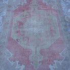 Close-up of the pale red neutral turkish rug showing neutral details, hand-knotted weave, wool and cotton and low pile.