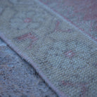 Pale Red 4' x 7' neutral turkish rug in wool and cotton, shown on the floor.