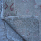 1970s pale red neutral turkish rug with neutral design, hand-knotted weave and low pile.