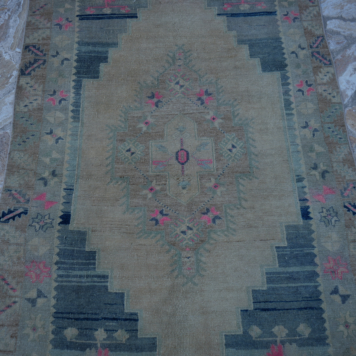 Close-up of the beige Turkish neutral vintage rug showing neutral details, hand-knotted weave, wool and low pile.