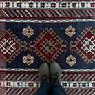 1970s blue Turkish oriental wool rug with traditional design, hand-knotted weave and low pile.