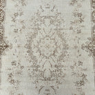 1970s beige Turkish oriental wool rug with medallion design, hand-knotted weave and low pile.