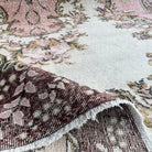 1970s brown Turkish oriental wool rug with medallion design, hand-knotted weave and low pile.
