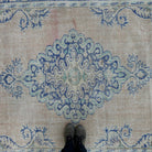 1970s blue Turkish oriental wool rug with medallion design, hand-knotted weave and low pile.