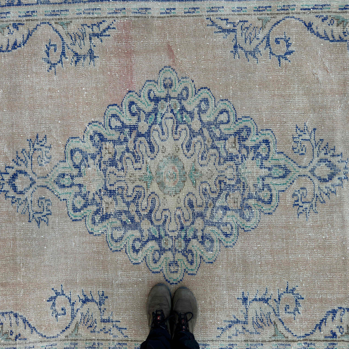 1970s blue Turkish oriental wool rug with medallion design, hand-knotted weave and low pile.