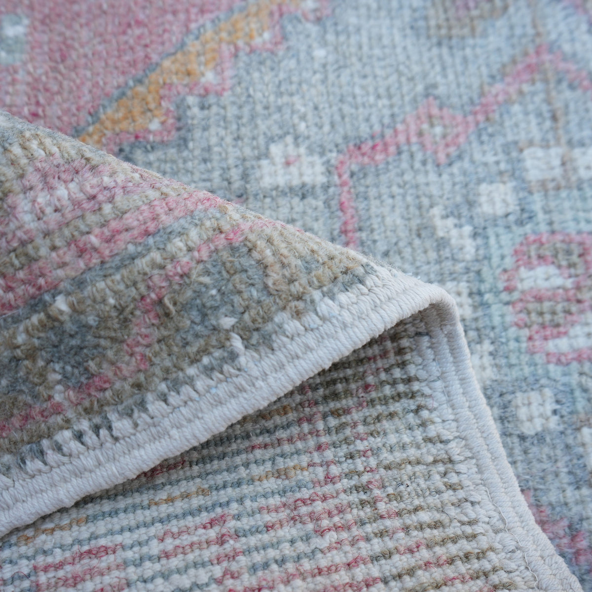 Additional view of the red Turkish oushak mini rug, hand-knotted in wool and cotton.