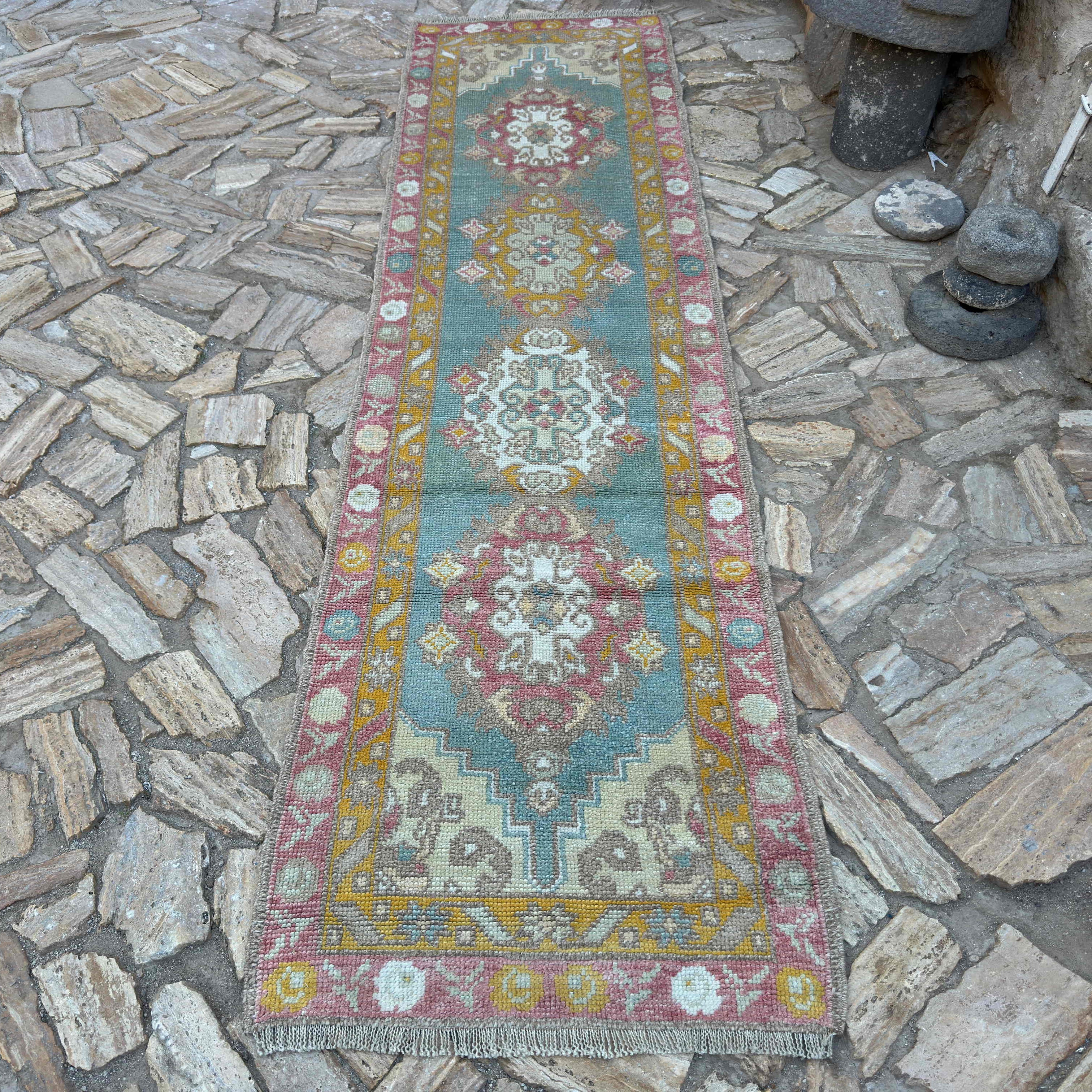 Green 3' x 11' Turkish oushak runner rug in wool and cotton, shown on the floor.