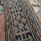 Close-up of the pale green Turkish oushak runner rug showing traditional details, hand-knotted weave, wool and cotton and low pile.