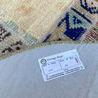 Blue 3' x 3' Turkish patchwork round rug in wool and cotton, shown on the floor.