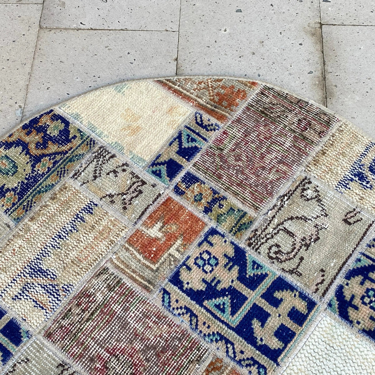 1970s blue Turkish patchwork round rug with patchwork design, hand-knotted weave and low pile.